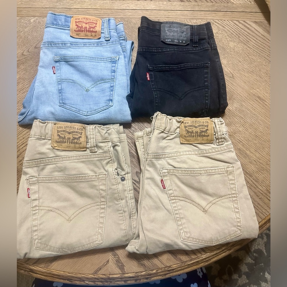 Bundle of 4 Excellent used Size 16 Levi Jeans: 1 Blue, 1 Black, 2 Tan.